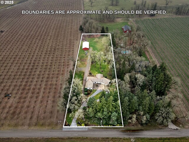 birds eye view of property featuring a rural view