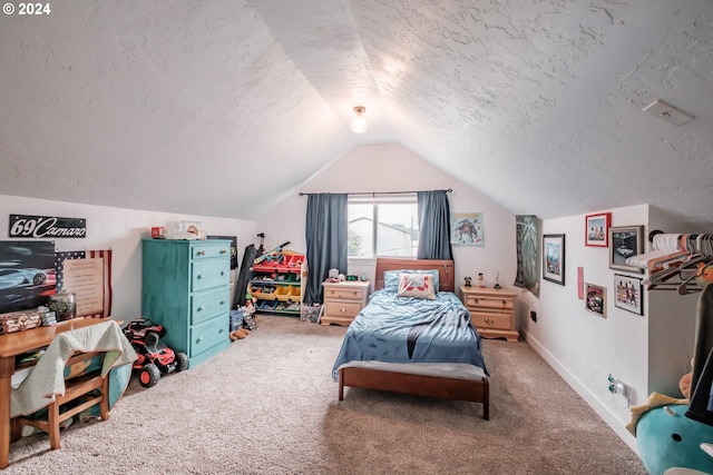 bedroom with a textured ceiling, baseboards, vaulted ceiling, and carpet flooring