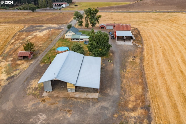 birds eye view of property with a rural view