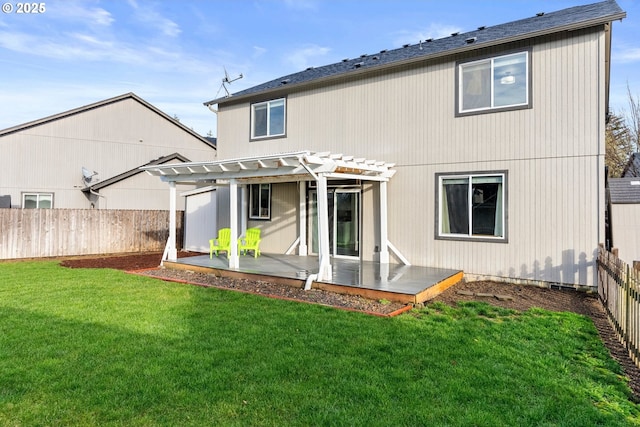 rear view of house with a lawn and a pergola