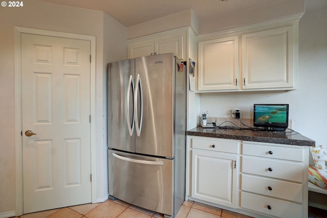 kitchen with white cabinetry, backsplash, sink, appliances with stainless steel finishes, and lofted ceiling