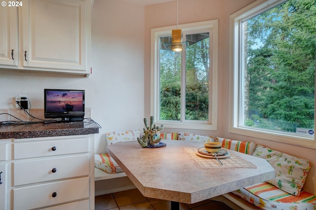 tiled dining space featuring breakfast area