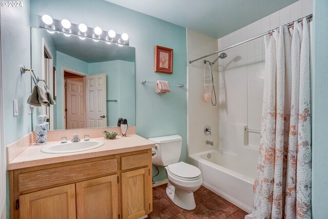 full bathroom featuring shower / bathtub combination with curtain, tile patterned flooring, toilet, and vanity