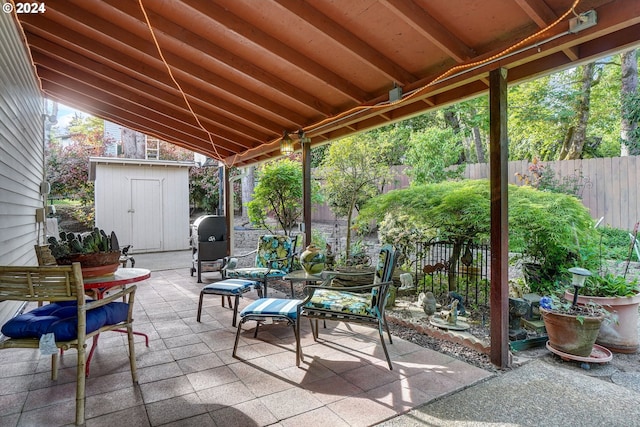 view of patio with a storage shed