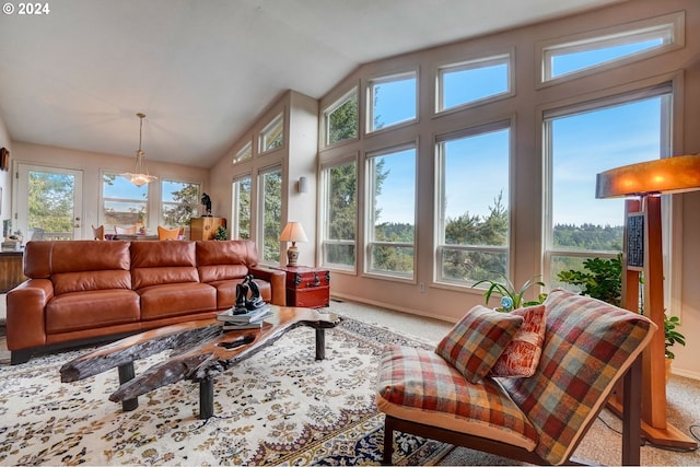 sunroom with lofted ceiling and plenty of natural light