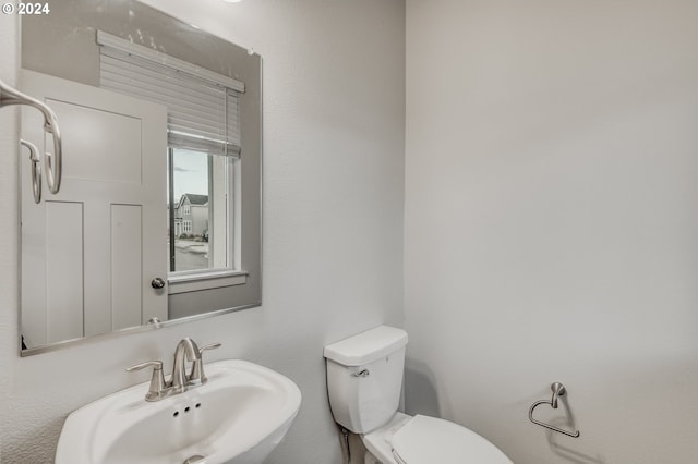 bathroom with toilet and sink