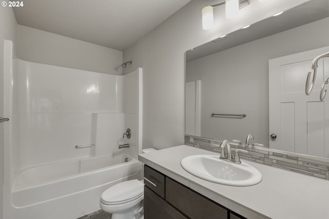 full bathroom featuring toilet, tasteful backsplash, shower / washtub combination, and vanity