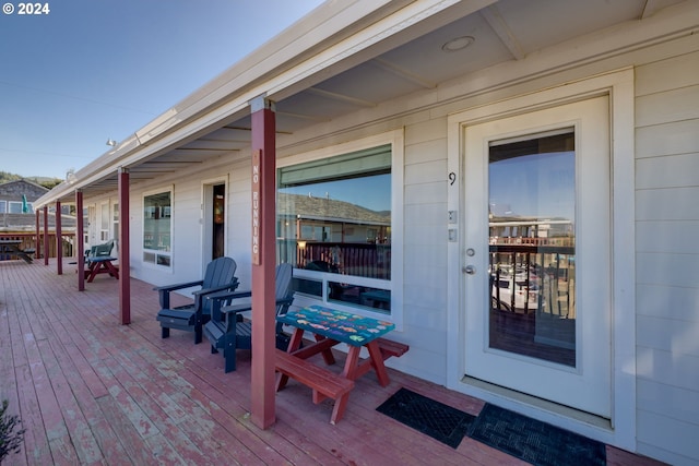 doorway to property with a wooden deck