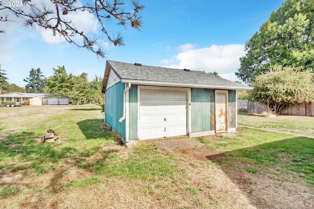 garage with a lawn