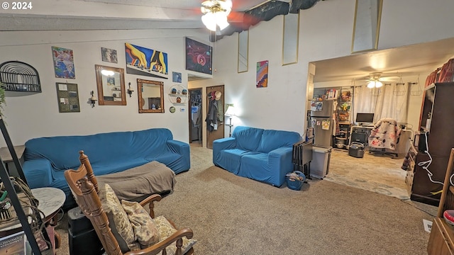 carpeted living room featuring vaulted ceiling with beams and ceiling fan