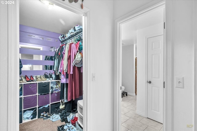 walk in closet featuring light tile patterned floors