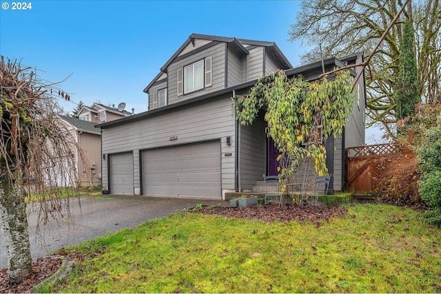 view of front facade with a garage and a front yard