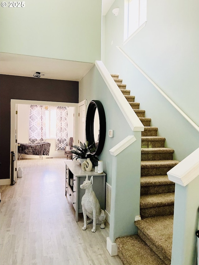 staircase featuring hardwood / wood-style flooring