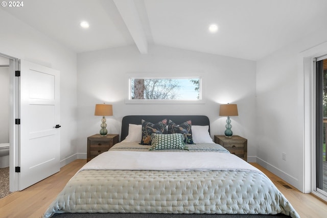 bedroom with hardwood / wood-style floors and vaulted ceiling with beams