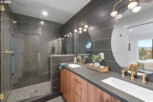 bathroom featuring vanity and an enclosed shower