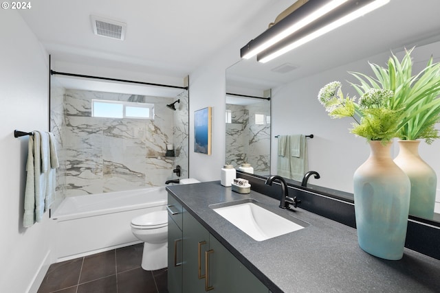 full bathroom with tile patterned floors, vanity, toilet, and tiled shower / bath