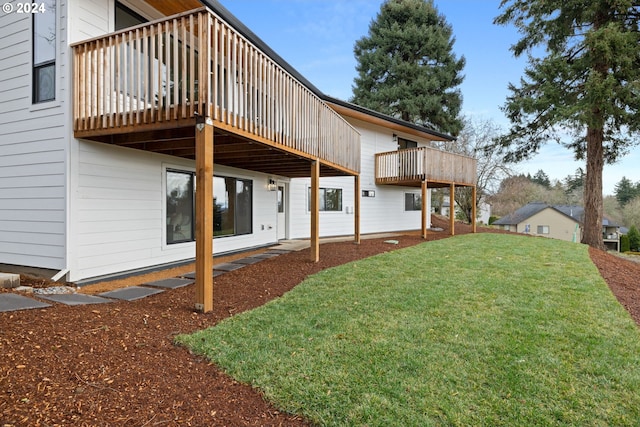 exterior space featuring a yard and a wooden deck