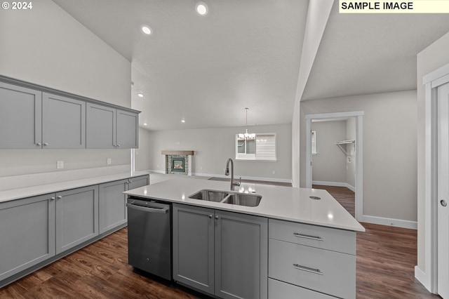 kitchen featuring gray cabinets, stainless steel dishwasher, dark hardwood / wood-style floors, and sink