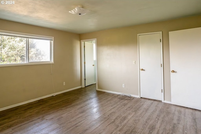 unfurnished bedroom with light hardwood / wood-style flooring