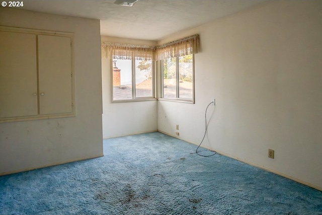 spare room with light colored carpet