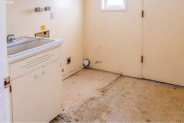 clothes washing area featuring hookup for an electric dryer and sink