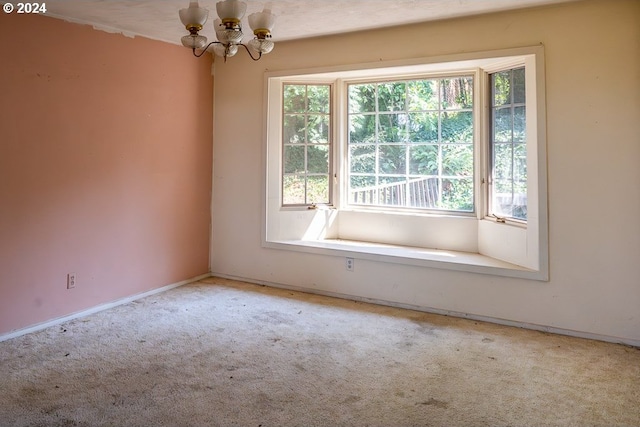 spare room featuring carpet and a healthy amount of sunlight