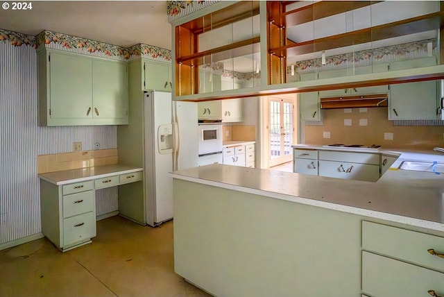 kitchen featuring french doors, sink, white appliances, and green cabinetry