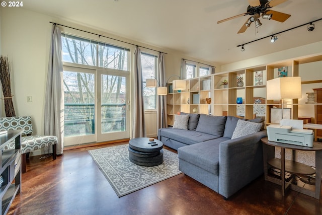 living room with ceiling fan and track lighting