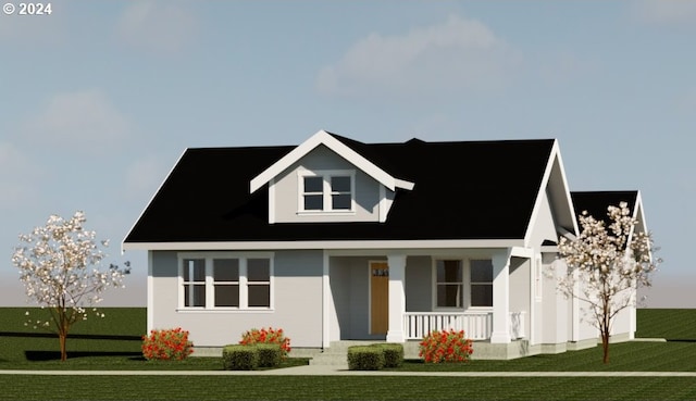 view of front of home with covered porch and a front lawn