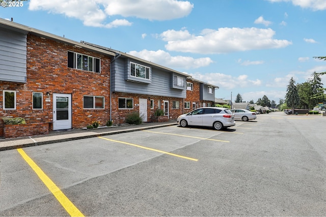 1763 NE 19th St, Gresham, OR 97030 - view of property with uncovered parking and brick siding