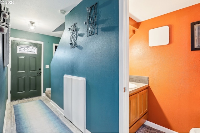 bathroom featuring vanity and wood-type flooring