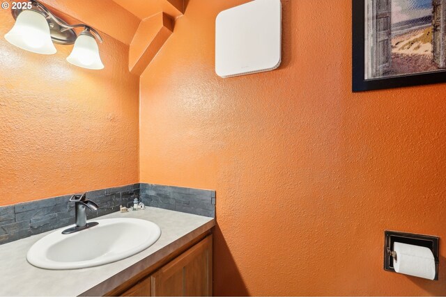 1763 NE 19th St, Gresham, OR 97030 - bathroom featuring vanity, a textured wall, and tasteful backsplash