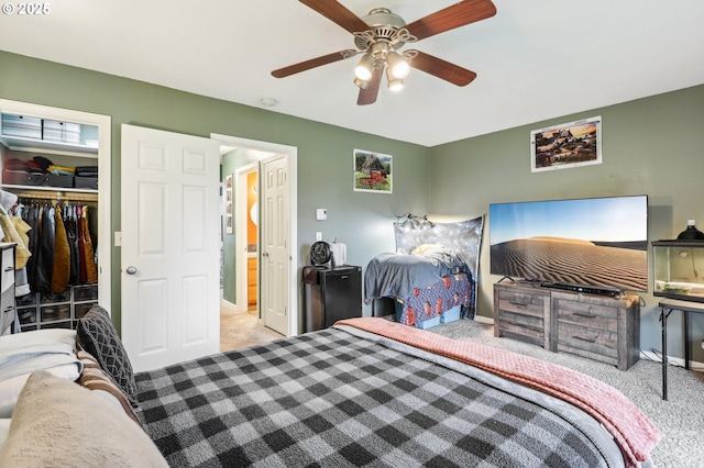 bedroom with light colored carpet, a closet, and ceiling fan