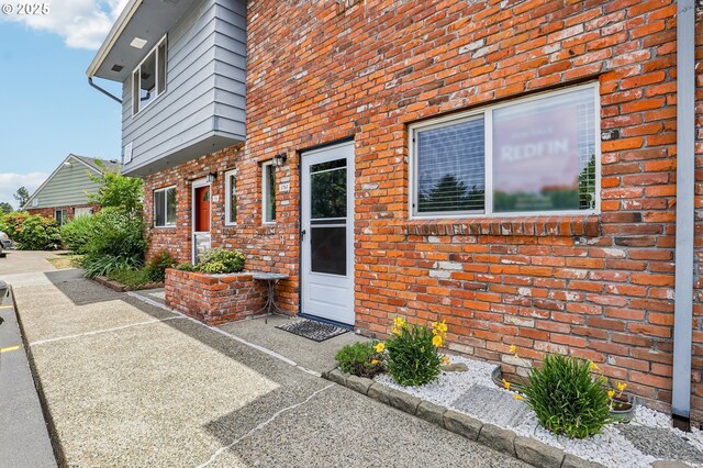 1763 NE 19th St, Gresham, OR 97030 - rear view of house featuring brick siding