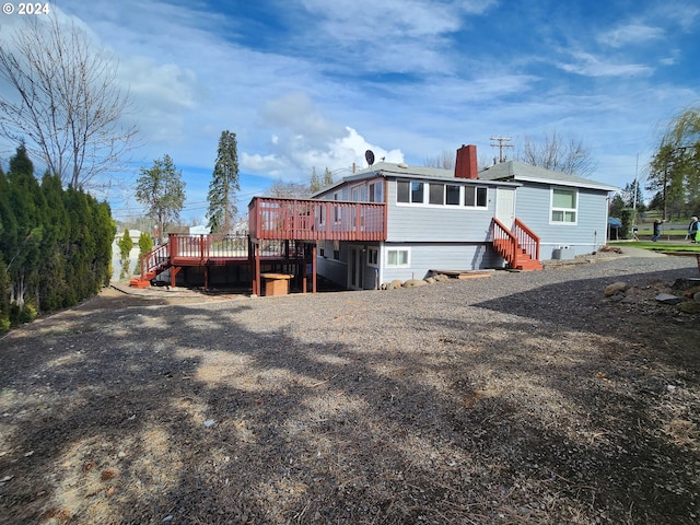 view of front of property with a wooden deck