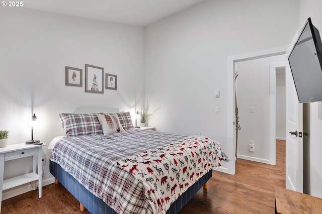 bedroom featuring dark hardwood / wood-style flooring