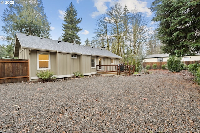 back of house featuring a deck