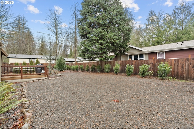 view of yard featuring a deck