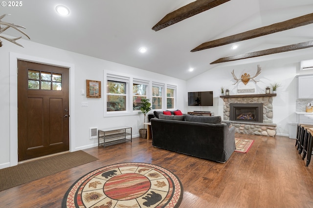 living room with vaulted ceiling with beams, a fireplace, wood-type flooring, and plenty of natural light