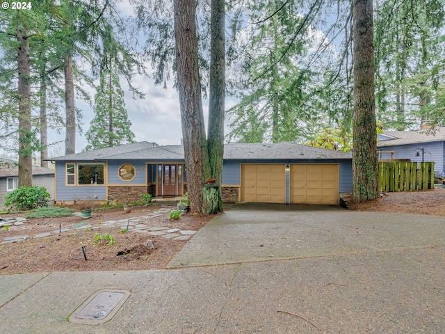 ranch-style home featuring a garage