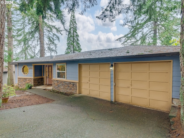 ranch-style home featuring a garage