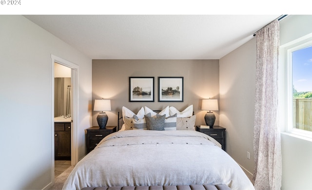 bedroom with sink and ensuite bath