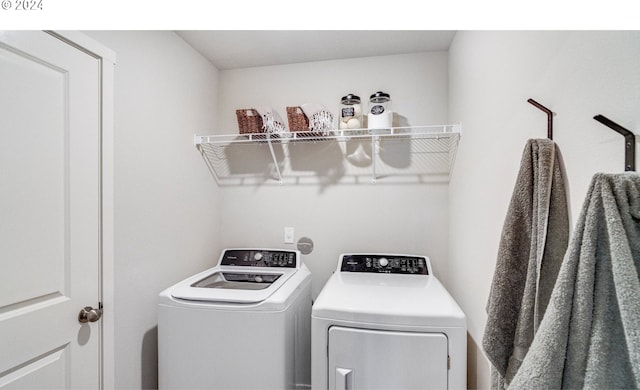 washroom featuring washer and dryer