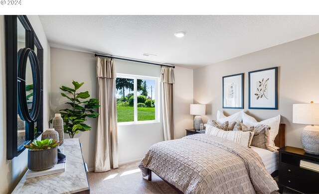 carpeted bedroom with fridge and a textured ceiling