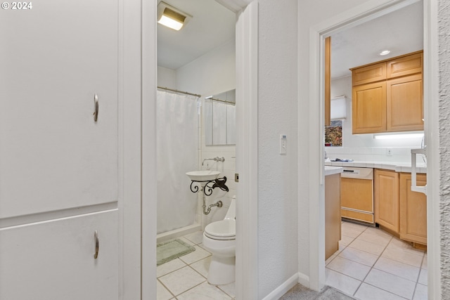 bathroom with tile patterned floors and toilet