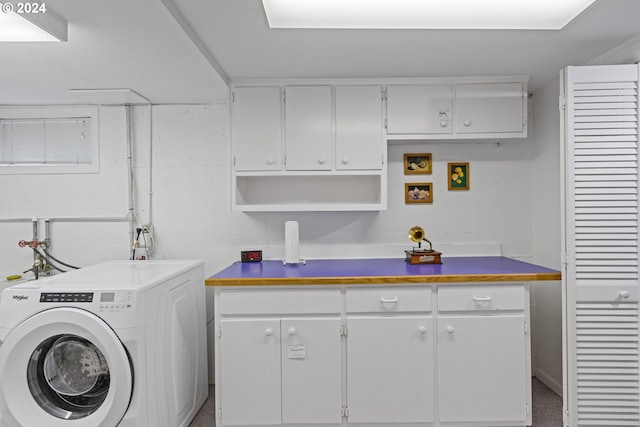 laundry area with cabinets and washer / clothes dryer