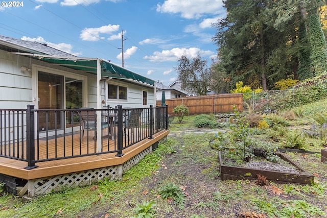 view of yard with a wooden deck