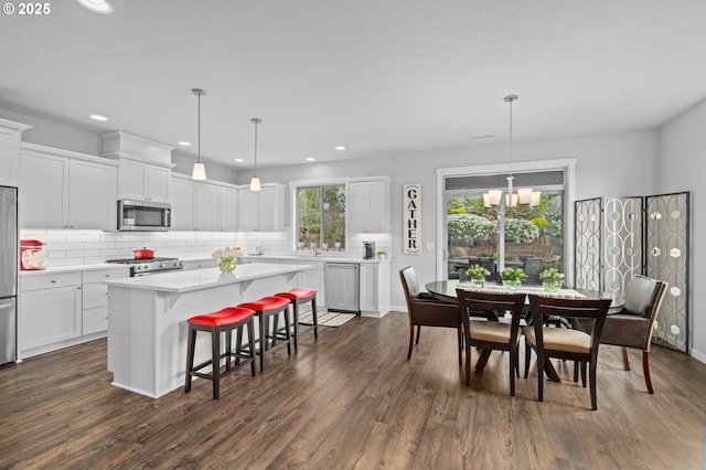 1010 NW 1st St, Dundee, OR 97115 - dining area with recessed lighting, a notable chandelier, and dark wood finished floors