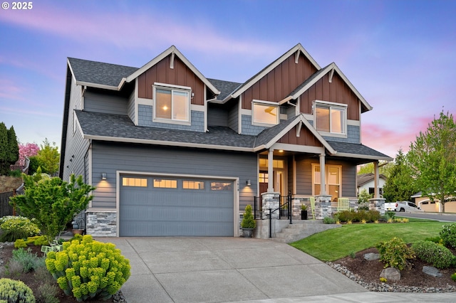 1010 NW 1st St, Dundee, OR 97115 - craftsman-style home with a yard, board and batten siding, driveway, a porch, and a garage