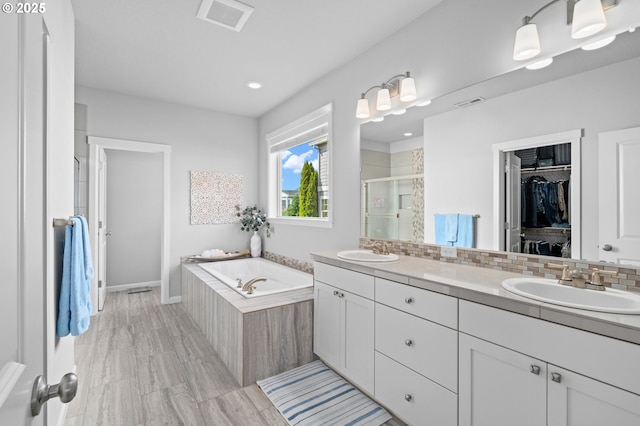 1010 NW 1st St, Dundee, OR 97115 - full bath with a shower stall, a sink, a spacious closet, double vanity, and visible vents